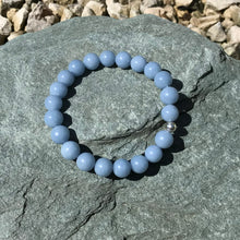Load image into Gallery viewer, Pale blue gemstone bracelet on stone
