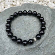 Load image into Gallery viewer, Black crystal bead bracelet on stone
