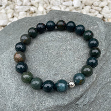 Load image into Gallery viewer, Bloodstone crystal bracelet on stone
