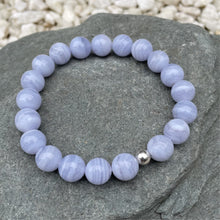 Load image into Gallery viewer, Blue lace agate crystal bracelet on stone
