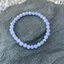 Load image into Gallery viewer, Blue lace agate gemstone bracelet on stone
