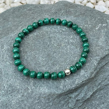 Load image into Gallery viewer, Green crystal bracelet on stone

