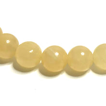 Load image into Gallery viewer, Cloce up of yellow calcite beads
