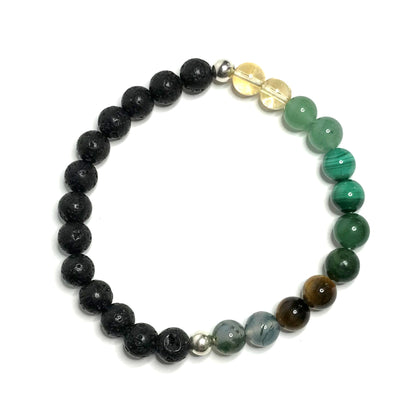 Abundance Abundance bracelet with lava showing 6 different crystals.