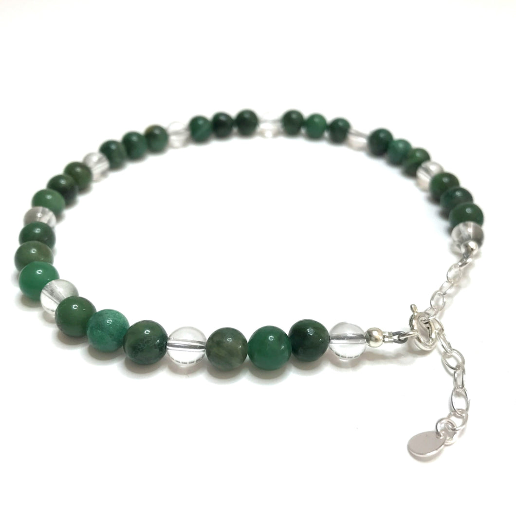 Anklet made with dark green and clear crystal beads and a sterling siver extender chain