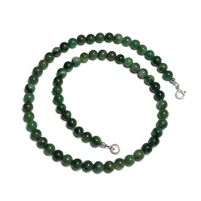 Dark green crystal bead choker necklace in a spiral shape.