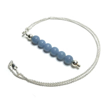 Load image into Gallery viewer, Light blue gemstone pendant on a sterling silver chain
