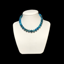 Load image into Gallery viewer, Blue crystal necklace on a white stand
