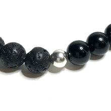Load image into Gallery viewer, Close up of a sterling silver bead between black tourmaline and lava beads

