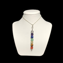 Load image into Gallery viewer, Chakra crystal pendant necklace on stand
