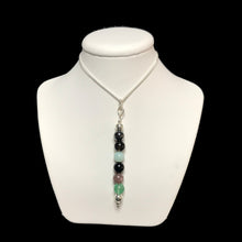 Load image into Gallery viewer, EMF protection crystal pendant necklace on a white stand
