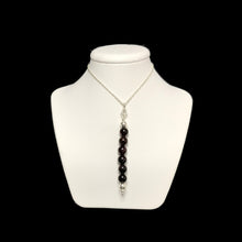 Load image into Gallery viewer, Garnet pendant necklace on stand
