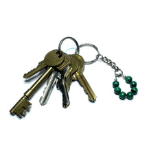Load image into Gallery viewer, Green gemstone keychain with a set of keys
