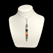 Load image into Gallery viewer, New beginnings crystal bead pendant on stand
