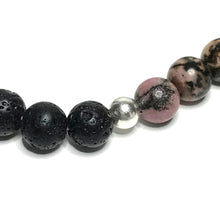 Load image into Gallery viewer, Close up of sterling silver bead between rhodonite and lava beads
