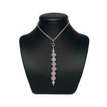 Load image into Gallery viewer, Rose quartz crystal pendant on stand
