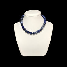 Load image into Gallery viewer, Sodalite crystal necklace on stand 
