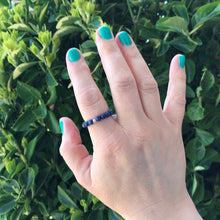 Load image into Gallery viewer, Hand wearing a sodalite beaded stretch ring
