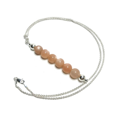 Sunstone crystal pendant on silver chain