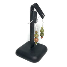 Load image into Gallery viewer, Unakite dangle earrings on a stand
