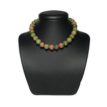 Load image into Gallery viewer, Unakite beaded necklace on a black stand
