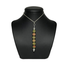 Load image into Gallery viewer, Unakite pendant necklace on a black stand
