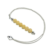 Load image into Gallery viewer, Yellow gemstone pendant with a sterling silver chain
