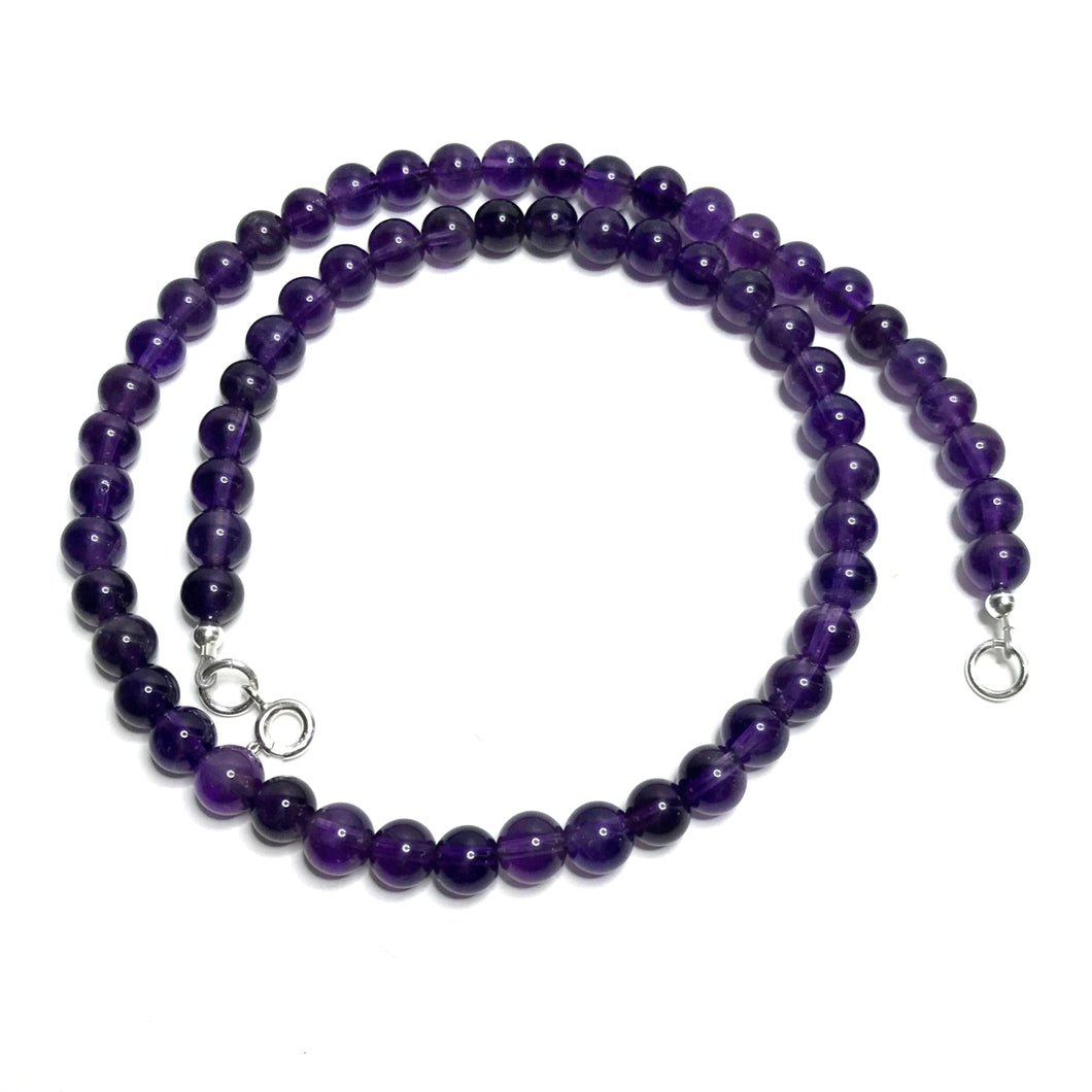 A beaded amethyst handmade choker necklace with a sterling silver clasp.