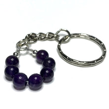 Load image into Gallery viewer, An amethyst bead kechain.
