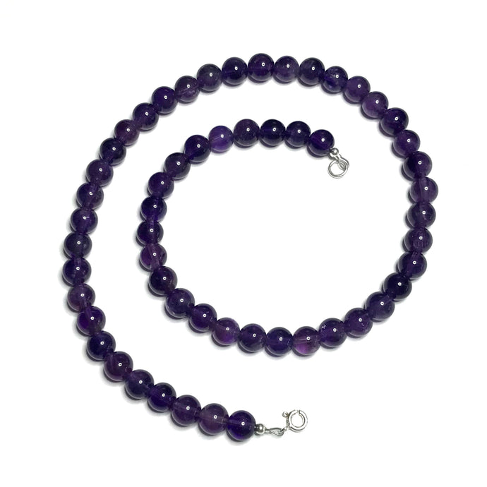 A beaded amethyst handmade necklace with a sterling silver clasp.