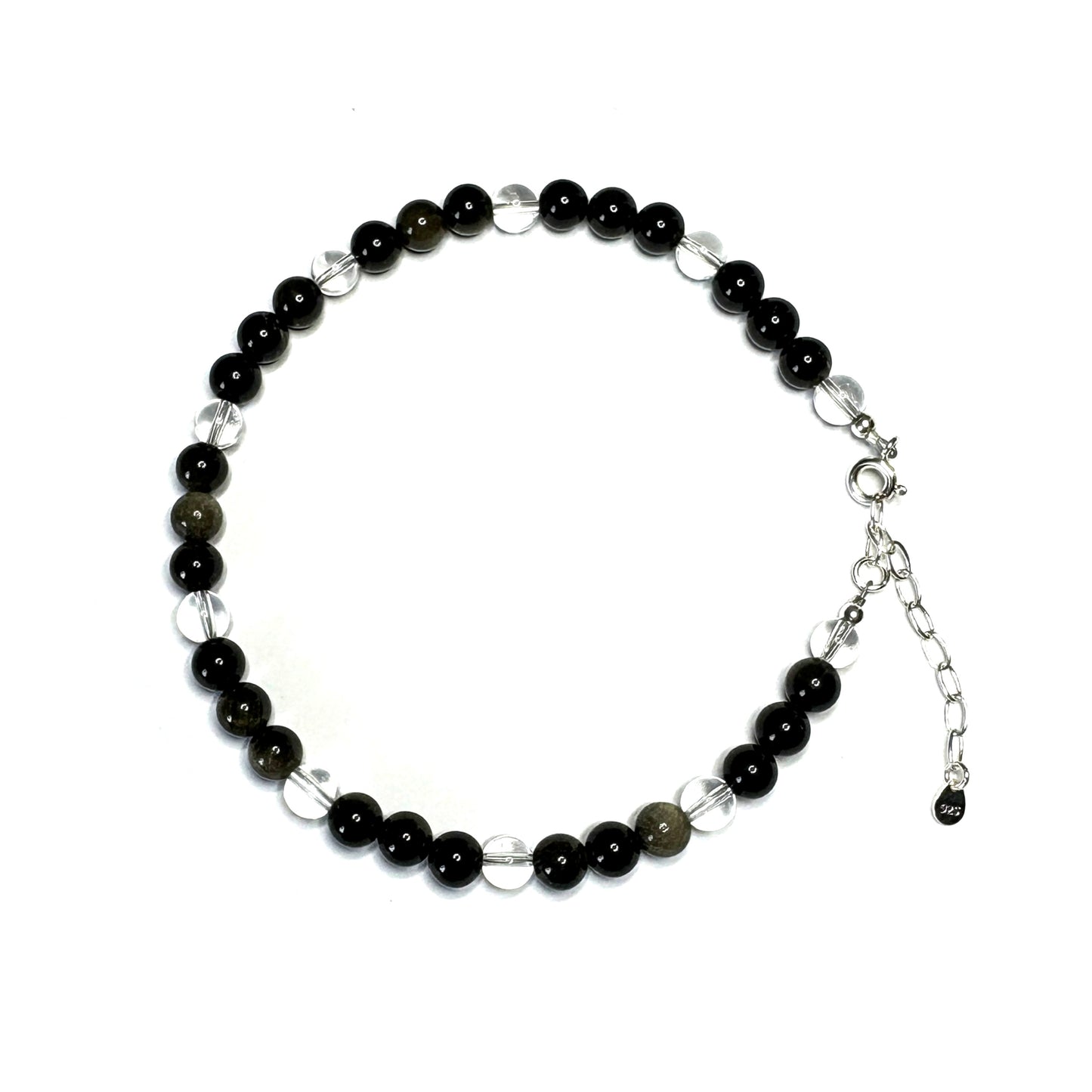 Black beaded bracelet with silver extender chain on a white background