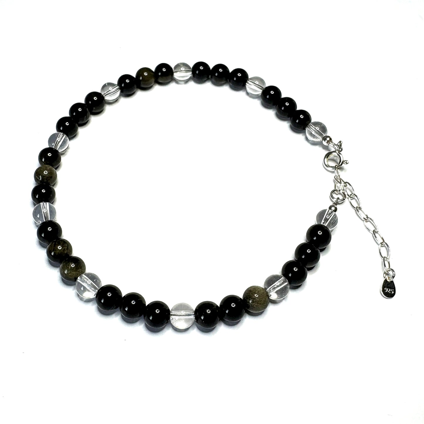 Beaded bracelet with black, silver, and clear beads on a white background