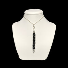 Load image into Gallery viewer, Hematite pendant necklace on stand

