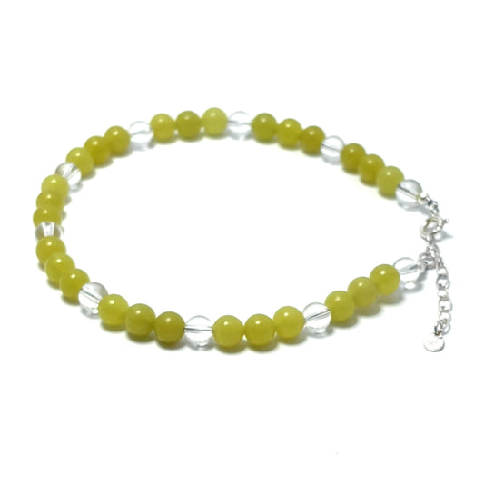 Beaded anklet with Lemon Jade beads and silver chain on a white background