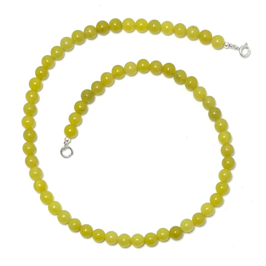 Lemon Jade choker necklace with yellow beads on a white background