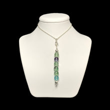 Load image into Gallery viewer, Rainbow fluorite pendant necklace on stand
