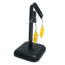 Load image into Gallery viewer, Yellow agate dangle earrings on stand
