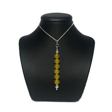 Load image into Gallery viewer, Yellow agate bead pendant on stand
