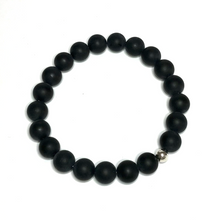 Load image into Gallery viewer, Handmade 10mm matte onyx bracelet on white background from above
