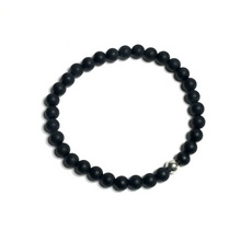 Load image into Gallery viewer, Handmade 6mm matte onyx bracelet on white background from above
